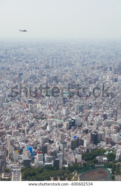 Japan Tokyo cityscape, commercial\
and residential building, road aerial view with\
helicopter