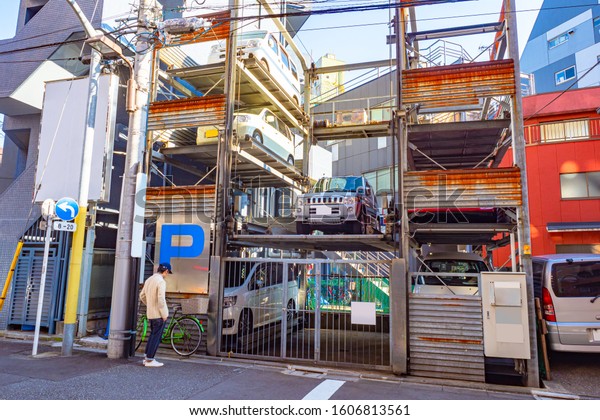 Japan.\
Tokyo. Street Parking in Tokyo. The garages are under each other.\
Car Parking on several floors. Space saving. Parking in a limited\
urban space. Automated car Parking in\
Japan.