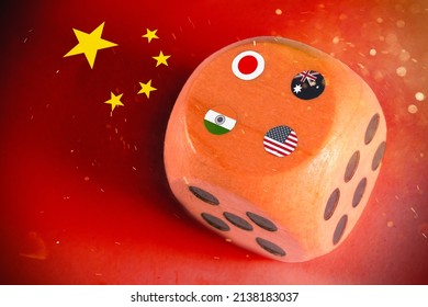 Japan,australia,usa And India  Countries Flags Paint Over On Wooden Dice. Chinese Flag Paint On Background.Quad Plus Countries.