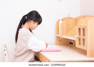 Japanese 6th Grade Girl Studying Alone