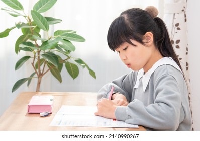 Japanese 6th Grade Girl Studying Alone