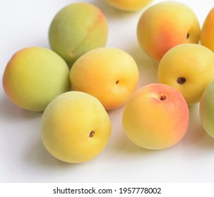 Japanese Apricots On White Background.
