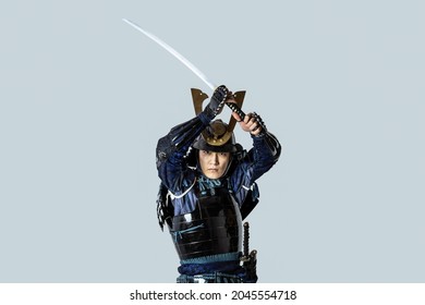 Japanese Armed Samurai Wielding A Sword. Japanese Traditional Warrior.