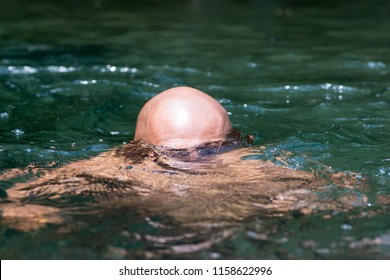 Japanese Bald Head Guy Emerging From Water