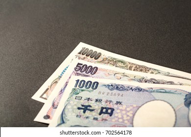 Money Currency Pile Of Japanese Banknotes 10 000 Yen On Plain