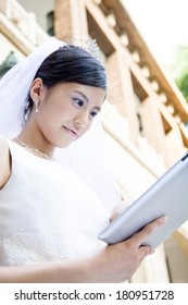 Japanese bride using a table PC