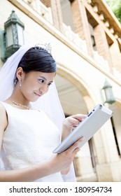 Japanese bride using a table PC