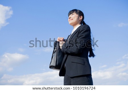 Japanese business woman with a bag
