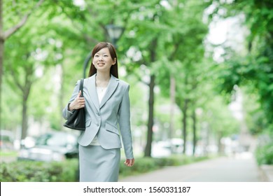 Japanese Business Woman Walking Outside