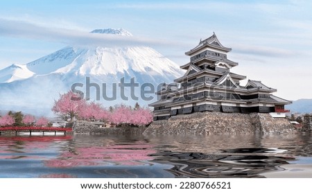 japanese castle in tokyo with cherry blossom, Fuji mountain blue sky and reflec of castle in river , Tokyo city, Japan