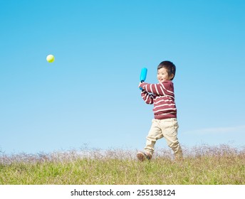 Japanese Child Swings The Bat