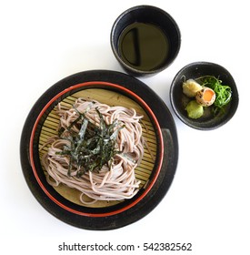 Japanese Chilled Soba Noodles On Black Pot With Quail Egg And Soy