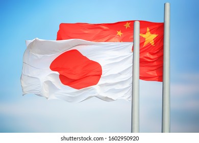 Japanese and Chinese flags amid blue skies
