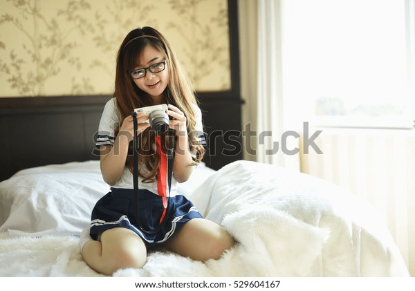 Japanese sexy girls posing on professional photographer's camera