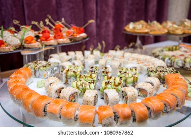 Japanese Cuisine -Buffet Catering Style Sushi Set In Restaurant - Salmon Maki Sushi And Nigiri Sushi. Selective Focus