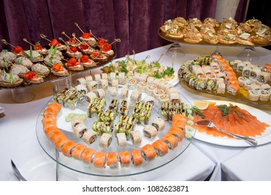 Japanese Cuisine -Buffet Catering Style Sushi Set In Restaurant - Salmon Maki Sushi And Nigiri Sushi. Selective Focus