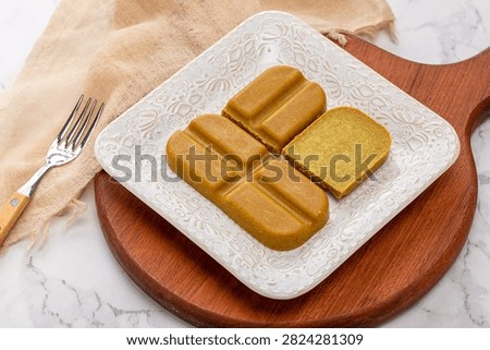 Japanese curry roux blocks, solid curry paste cubes for making traditional Asian savory stew, aromatic culinary ingredient.