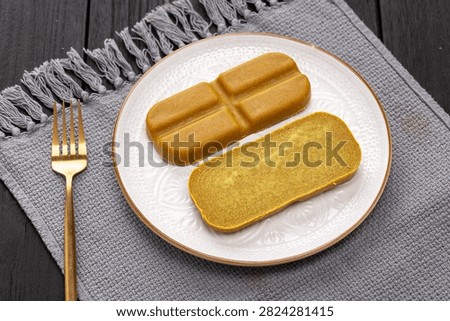 Japanese curry roux blocks, solid curry paste cubes for making traditional Asian savory stew, aromatic culinary ingredient.