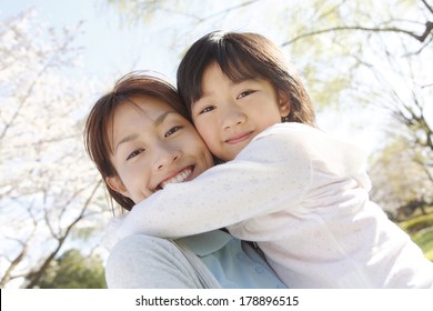 Japanese Daughter Hugging Her Mother