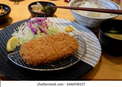 Japanese deep fried pork cutlet (tonkatsu set). Tonkatsu, Japanese pork cutlet. Deep fried pork cutlet. deep fried breaded pork tenderloin or cutlet served with shredded cabbage.