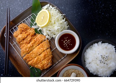 Japanese deep fried pork or tonkatsu set with rice in studio lighting.