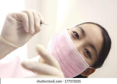 Japanese Dental Hygienist To Check The Teeth