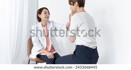 Japanese doctor counseling a woman