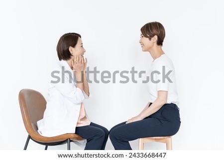 Japanese doctor counseling a woman