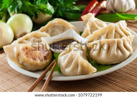 Japanese dumplings - Gyoza with pork meat and vegetables on a plate