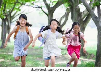 Japanese Elementary School Students In The Way To And From School