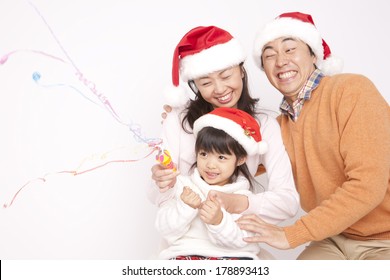 Japanese Family Enjoying The Christmas Party