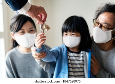 Japanese Family In Face Mask Buying A New House