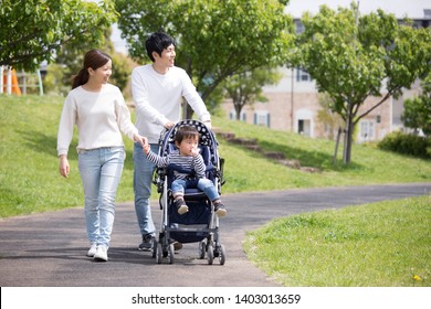 Japanese Family Pulled A Stroller To Walk In The Park