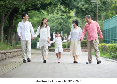 Japanese Family Walk In The Park