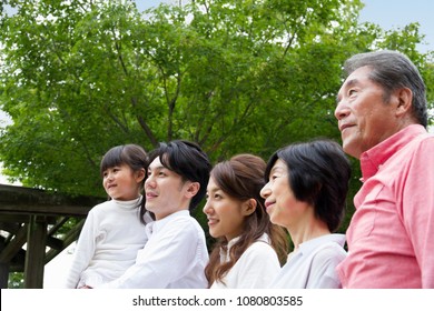 Japanese Family Walk In The Park