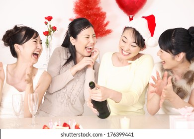 Japanese Female Eating Cake At A Christmas Party