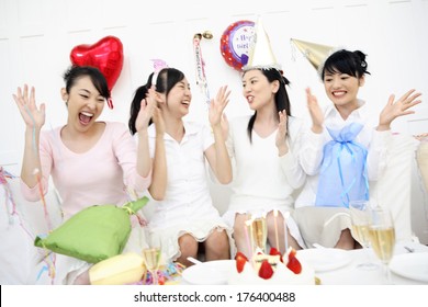 Japanese Female Eating Cake At A Christmas Party