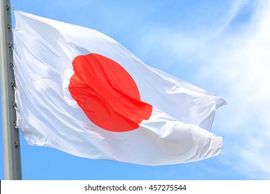 The Japanese flag against the blue sky