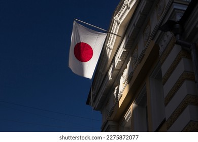 Japanese flag hanging on a flagpole. Japan national flag. 日本の国旗. Close up. Bottom up view.