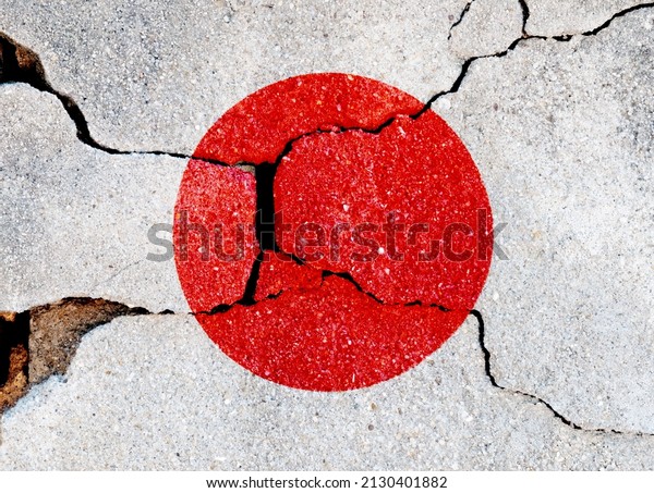 Japanese flag on cracked\
concrete wall.