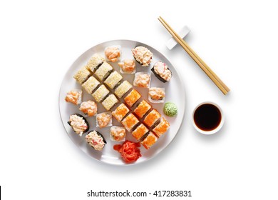 Japanese food restaurant, sushi maki gunkan roll plate or platter set. Set for two with chopsticks, ginger, soy, wasabi. Sushi isolated at white background. Top view, flat lay. - Powered by Shutterstock