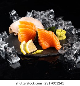japanese food, salmon sashimi in an Asian restaurant, salmon sashimi with black background. Japanse cuisine. A variety of Japanese food - Shutterstock ID 2317001241