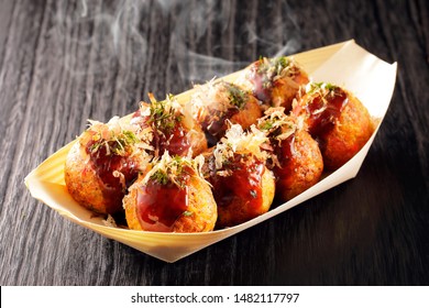 Japanese food Takoyaki on black background