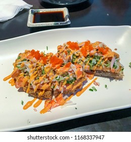 Japanese Fried Sushi Pizza On A Plate With Spicy Mayo