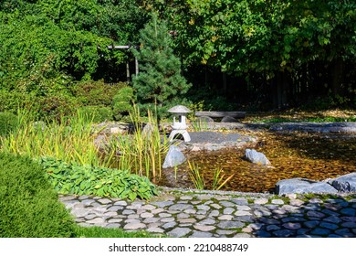 Japanese Garden. Pond And Lantern. Botanical Park In Early Autumn. Sunny Autumn Day