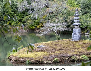 Japanese garden with pond a Spring day, Stone lantern and lush greenery, moss covered rocks, calm water, Springtime - Powered by Shutterstock