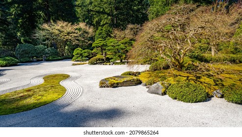 A Japanese Garden In Porltand Oregon.  The Pea Gravel Signifies Water In This Zen Garden. Raking The Pea Gravel  Creates Waves And Patterns That Resemble Water.