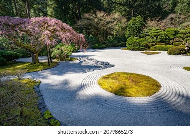 A Japanese Garden In Porltand Oregon.  The Pea Gravel Signifies Water In This Zen Garden. Raking The Pea Gravel  Creates Waves And Patterns That Resemble Water.