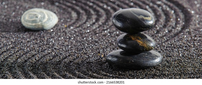 Japanese Garden With Yin Yang Stone In Textured Sand