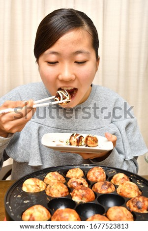 Japanese girl enjoys Octopus fritters party